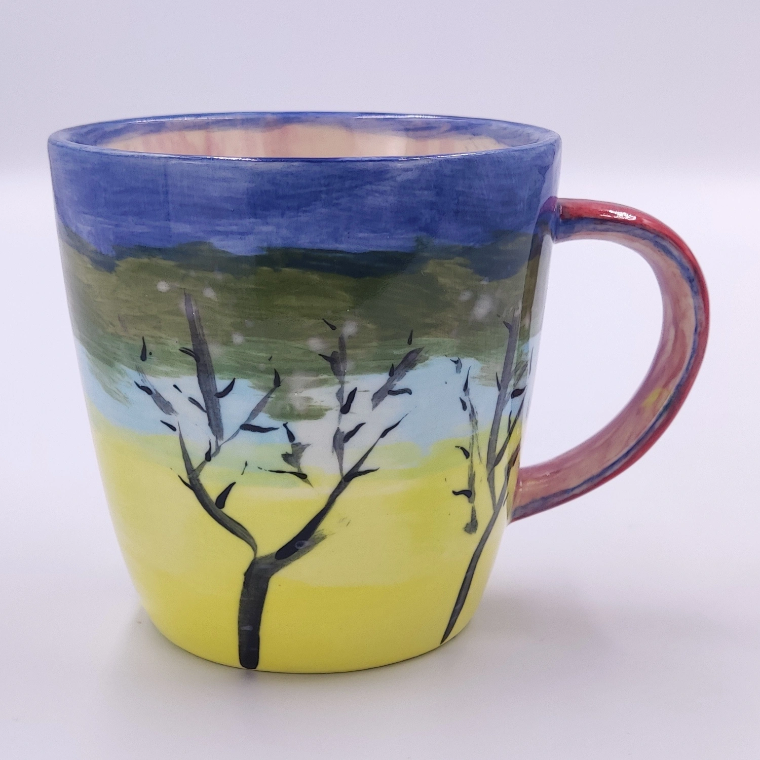 malowanie_ceramiki_gdansk_kubek038l_krajobraz_drzewa Kubek 0,38l z malowanym krajobrazem z warsztatów ceramicznych w Gdańsku - praca uczestnika kursu malowania ceramik
